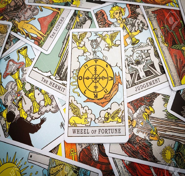 44094186-tarot-cards-tarot-the-wheel-of-fortune-card-in-the-foreground ...